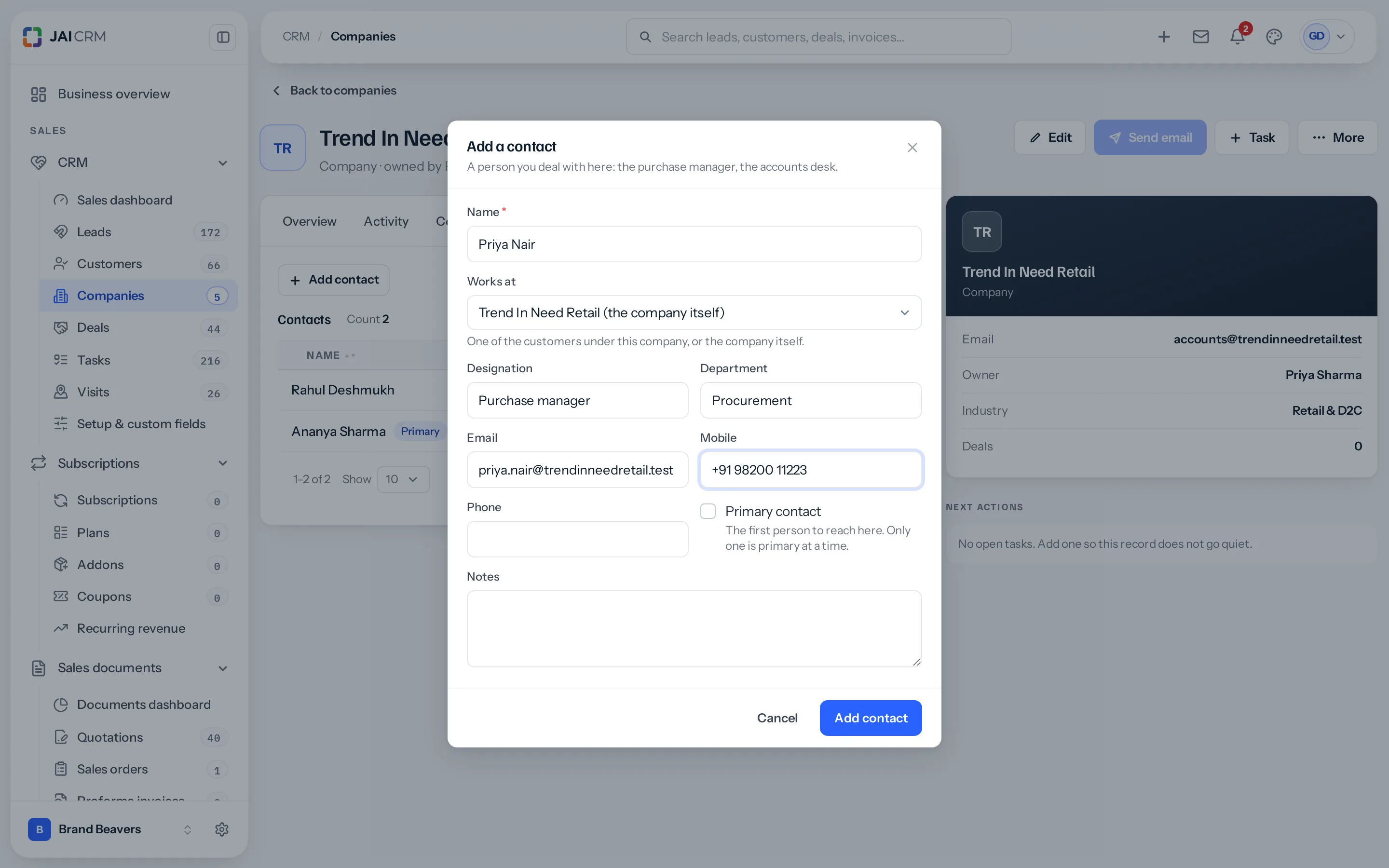 A company page with the Add a contact window open: Name Priya Nair, Works at Trend In Need Retail (the company itself), Designation Purchase manager, Department Procurement, an email and a mobile number, a Primary contact tick box, Notes, and Cancel and Add contact.
