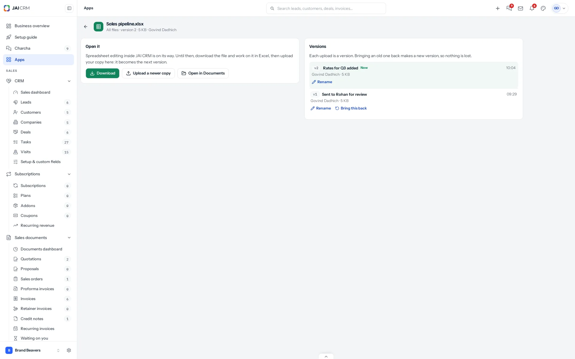 A spreadsheet open in Apps: Download, Upload a newer copy and Open in Documents on the left, and its versions on the right, each with who made it, when, a name and Bring this back.