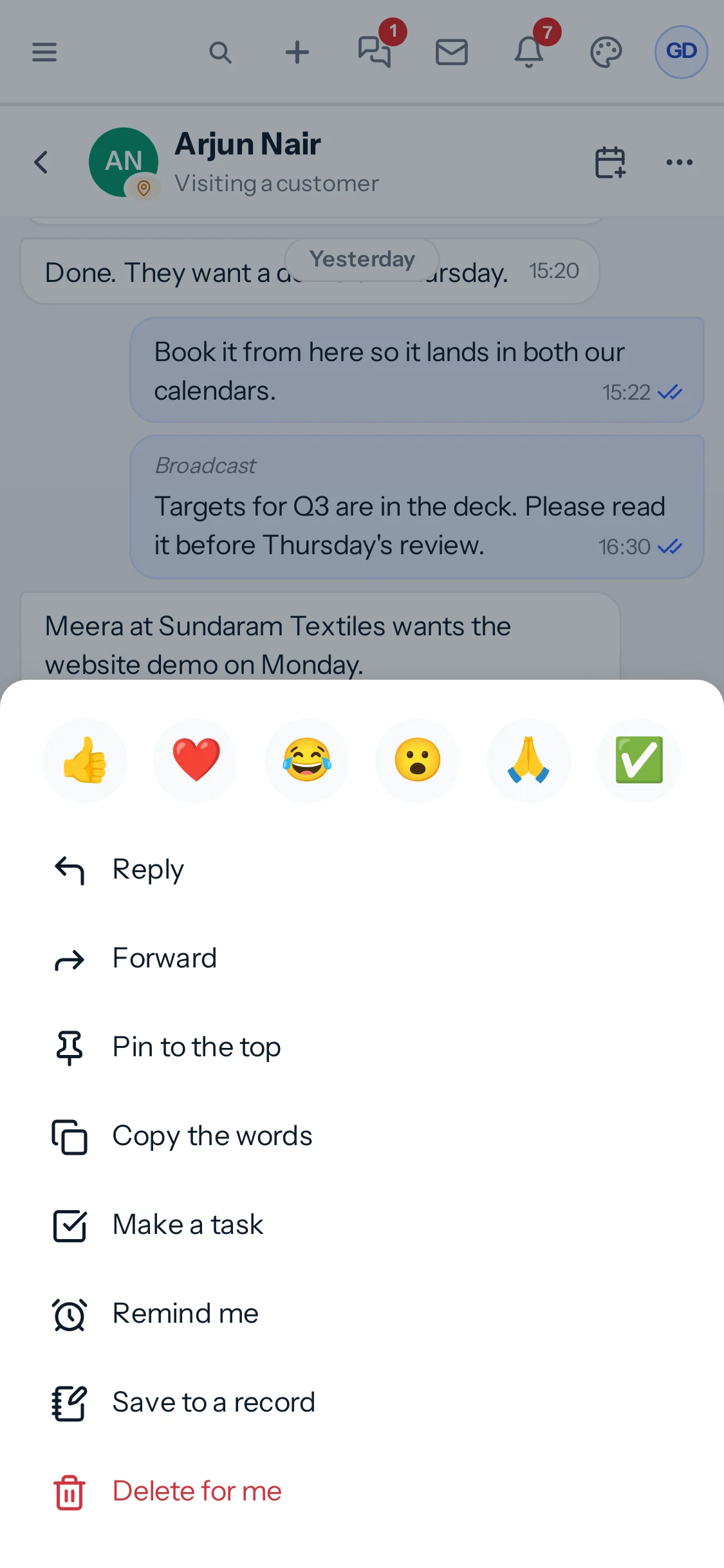 On a phone, pressing and holding a message opens a sheet with reactions, Reply, Forward, Pin to the top, Copy the words, Make a task, Remind me, Save to a record and Delete for me.