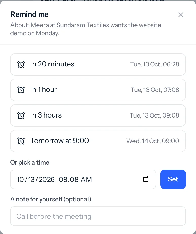 The Remind me window about Meera at Sundaram Textiles wanting the website demo on Monday, with four quick choices each showing the time it will ring, a box to pick a time, and a box for a note.