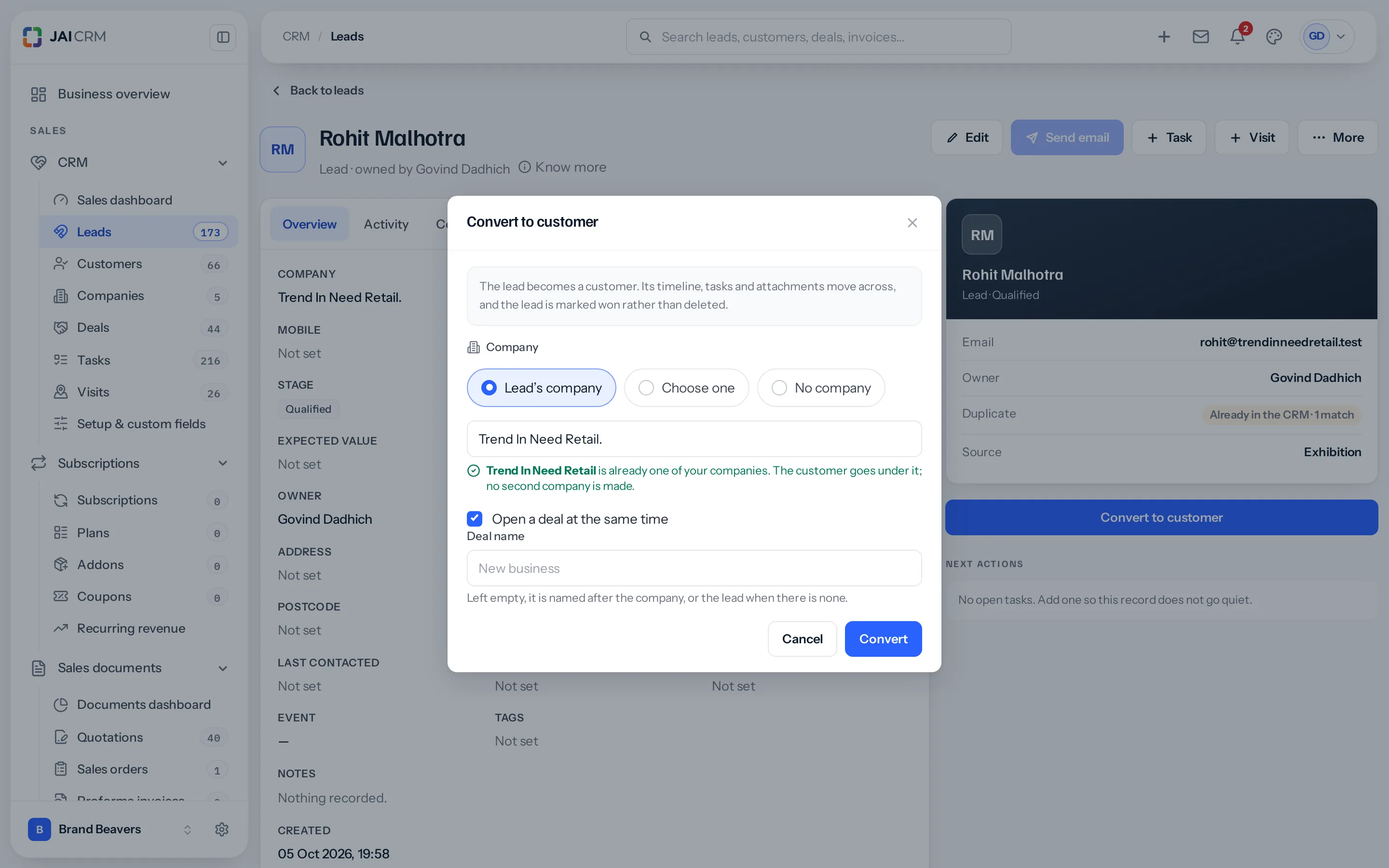The Convert to customer window over Rohit Malhotra’s lead page: Company set to Lead’s company with the name Trend In Need Retail. typed, a green line saying Trend In Need Retail is already one of your companies and the customer goes under it, no second company is made, Open a deal at the same time ticked, and Cancel and Convert.