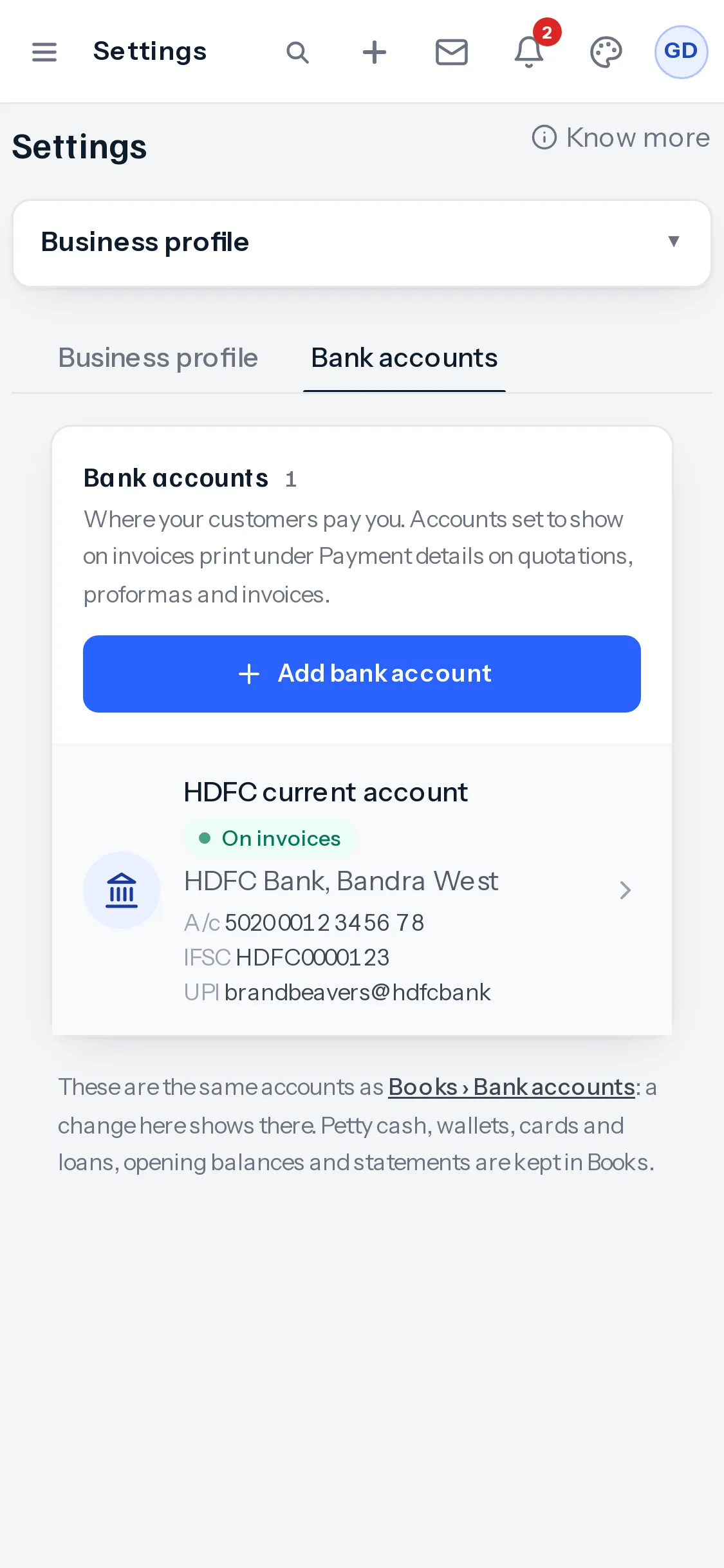 On a phone, the Bank accounts tab: the heading and a sentence about where customers pay, a full-width Add bank account button, then HDFC current account with its bank, branch, account number, IFSC and UPI ID.