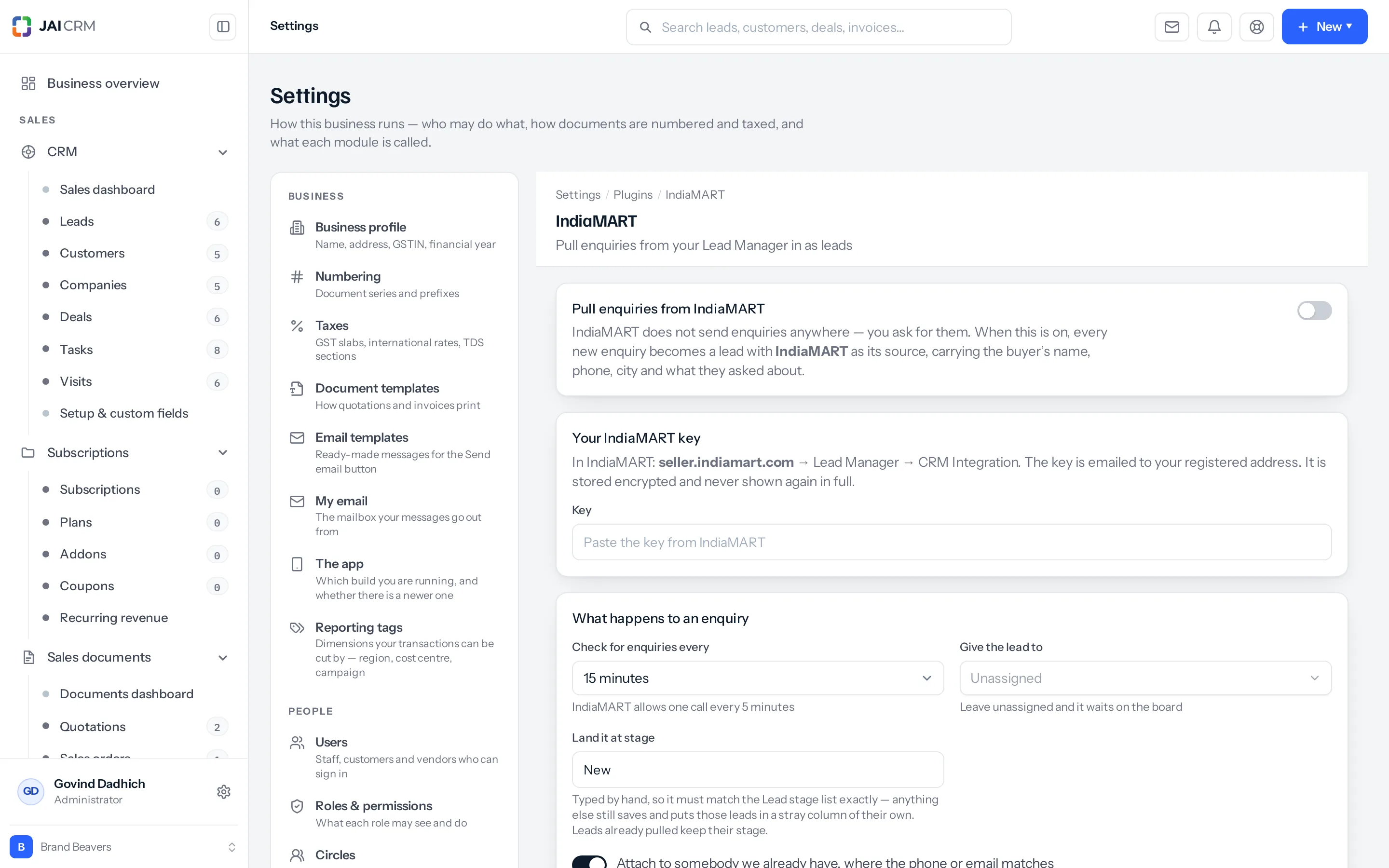 Settings, IndiaMART. A switch headed "Pull enquiries from IndiaMART", a card for the key, and a card headed "What happens to an enquiry" with how often to check, who to give the lead to, and which stage to land it at.